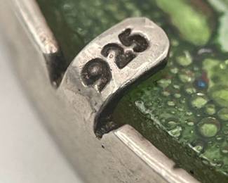 Closeup of sterling mark on sterling silver and glass watermelon brooch