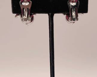 Back of Crown Trifari milk glass and rhinestone clip earrings