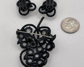 Reverse of 1960s milk glass grape cluster brooch and clip earrings