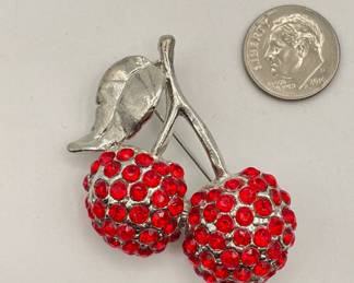 Bright sparkling red rhinestone two cherries brooch in a bright silver tone setting