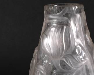 Closeup of TIFFANY STUDIOS fine wheel-carved vase. Rare rock crystal glass vase with magnolias, New York, ca. 1906; wheel-carved and martelé texturing; etched L.C. Tiffany - Favrile, and numbers 4238A and 7208; size 9 1/2" x 4 1/4"