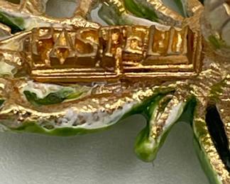 Closeup of beautiful vintage enameled Pastelli brooch with clip earrings, with tiny clear gold crystals