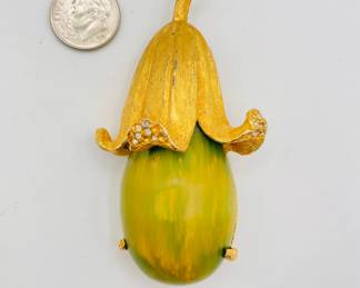 1930s-1940s squash form brooch, Bakelite and gold tone metal with small rhinestones
