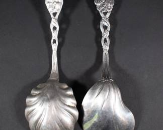 Another view of sterling silver large serving spoons with berry finial handles - one marked Tiffany & Co. Sterling