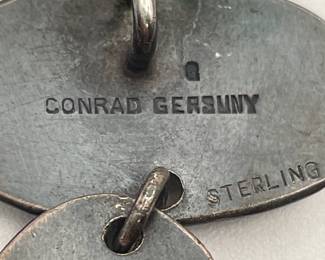 Closeup of New York artist Conrad Gersuny vintage sterling and coral pendant