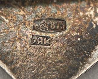 Closeup of makers marks on back of 1970s amber bead brooch from Soviet Russia