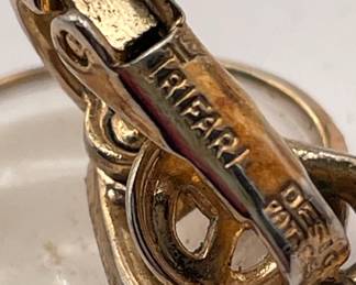 Closeup of Crown Triffari Faux Pearl cluster earrings, clip fittings