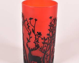 Another view of a striking vivid red art glass vase, cameo carved to depict a black design of a stag standing amidst slender trees - branches even rising from his antlers. Unsigned.