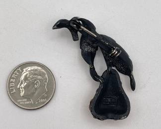 Reverse side of Vintage J.J. Jonette pear brooch, enameled metal and pavé set amber color rhinestones