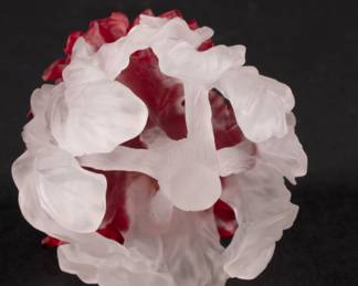 Underside of Barry Sautner art glass paperweight, carved frosted red and white glass depicting flowers and leaves