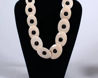 Bead and bone necklace, black beads and oval polished natural color bone, likely bovine; possible made in Africa or Middle East 