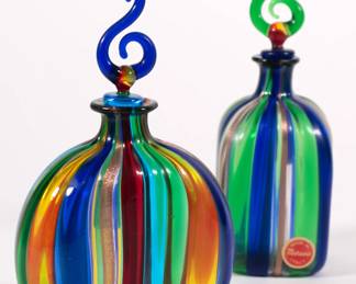 Another view of pair of vibrant Murano glass decanters with stylized curved stoppers. Made in Italy, original labels.