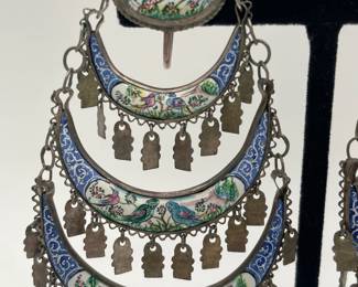 Closeup of Persian sterling silver enameled hand painted filigree dangle earrings