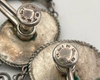 Closeup of backs of Persian sterling silver enameled hand painted filigree dangle earrings