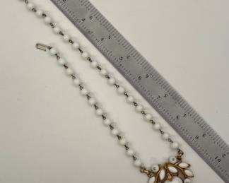 Another view of Crown TRIFARI white milk glass apple pendant and white glass beaded necklace in gold tone metal - iconic designer piece! 