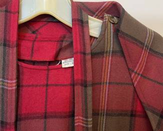 Closeup of 100% wool red plaid dress with matching belt and scarf/cape top, size 12, made in Hong Kong