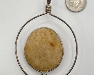 Reverse view of art glass and metal wire pendant, signed 76 Carol