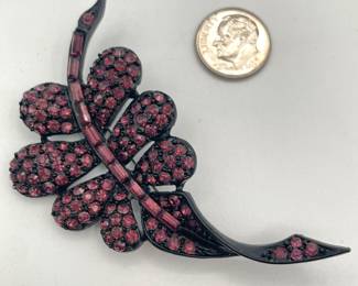 PELL leaf brooch, graceful curved black enameled frame with deep pink faceted rhinestones