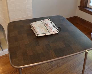 Card table with separate tablecloth printed with card game instructions