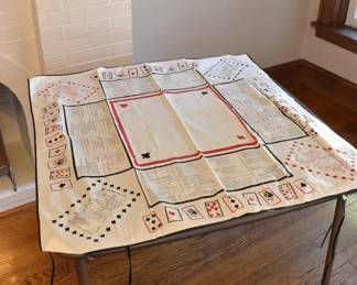 Card table with separate tablecloth printed with card game instructions