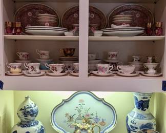 From the top shelf, set/3 hand-painted Bavarian porcelain platters, pair of antique Italian Capodimonte vases, 32-piece set of vintage Chinese red famille rose longevity porcelain, gorgeous Mottahedeh "Tea Garden" platter by Vista Allegre (Portugal), antique Bavarian porcelain chocolate set, blue/white Asian porcelains and Japanese Imari plate.