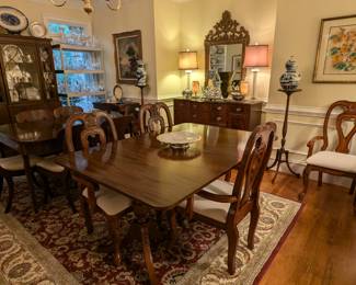 This family LOVED to entertain, hence the two vintage mahogany dining tables. One of the tables is 1930's inlaid mahogany, by Biggs Furn. Co. (with pair of 18" leaves and protective pads) and set of 6 matching side chairs, the other is a Duncan Phyfe style mahogany table with 6 upholstered armchairs.