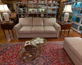 View from the fireplace in the great room, with the "Micky Mouse" adjustable brass/glass coffee table, vintage Persian Bakhtiari rug, pair of Biggs drop-leaf, 2-drawer, 1930's mahogany side tables, pair of Asian porcelain table lamps and a view of the amazing barrage of serving dishes, bowls, platters, stemware - you name it for grand entertaining!