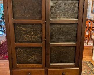 Vintage wooden pie safe, with perforated metal doors, to cool granny's pies on the back porch, with splatterware bowl by Roseville, antique 3-qt. blue salt glazed UHL pitcher, from Dry Foot, IN, 21.5" hand-painted Italian turkey platter and glass cock bottle.