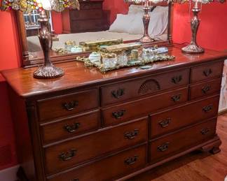 Vintage Ethan Allen mahogany dresser, w/matching mirror, pair of Tiffany style stained glass table lamps, brass vanity mirror and assorted doodads to primp and powder with.