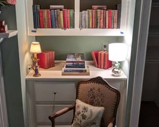 Sweet, vintage needlepointed French Armchair, with bookcase fi=iull of really cool, old books. 