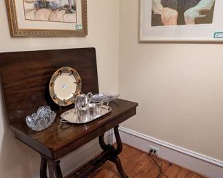 1930's Duncan Phyfe style mahogany game table, w/brass feet, ABCG ice cream trays, silver plated tea set, original framed/matted watercolor by Betty Lowe and signed/numbered lithograph #176/205 "Two Women" by listed artist Leonor (Eleonora) Fini 1907-1995; Argentina-France.