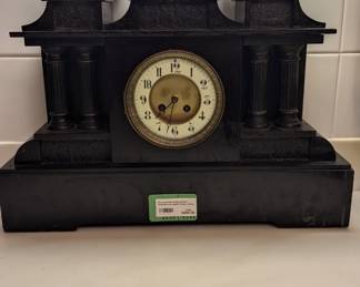 Monumental antique black slate and bronze Italian clock, measuring 1' 21" long x 1' 23" to the top of the bronze figure. The bronze figure atop this clock is Lorenzo de Medici - "Banker, de facto ruler of the Florentine Republic and the most powerful and enthusiastic patron of Renaissance culture in Italy . Also known as 'Lorenzo the Magnificent' by Contemporary Florentines, he was a magnate, diplomat, politician and patron of scholars, artists and poets".