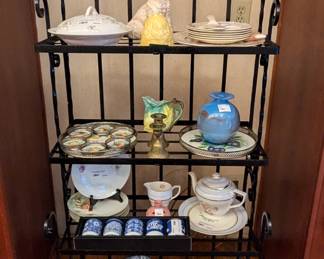 Vintage wrought iron bakers rack, with all kinds of things you can't live another day without. 