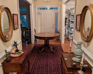 Beautiful foyer, with round, 4-drawer Maitland-Smith table, antique English burl wood desk, vintage Queen Anne side table, w/ candle slides, pair of gilt wood oval mirrors, vintage hand-woven Persian Malayer gallery runner, measuring 13'6" x 4'2".