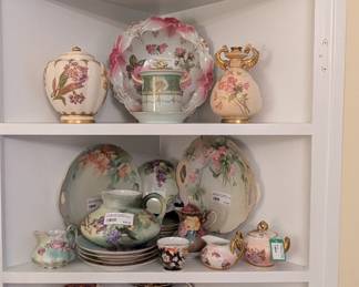 Built-in dining room cabinet with antique, hand-painted porcelains, Nippon porcelain and Japanese Imari china.