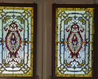 Sweet matched pair of stained glass panels.
