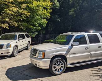 His & Hers Cadillac Escalades!                                                     He bought the 2005, then she had to have a new one in 2014, same colors, White Diamond Tricote, w/Cashmere interior - a great color combo for scorching hot Atlanta summers.                                                                                              
More info can be found here, for the 2005: 
https://atlanta.craigslist.org/nat/cto/d/atlanta-2005-cadillac-escalade-platinum/7793489398.html                             
More info can be found here, about the 2014 Escalade: 
https://atlanta.craigslist.org/nat/cto/d/atlanta-2014-cadillac-escalade-esv/7793490924.html
