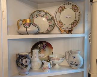 Built-in dining room cabinet with antique, hand-painted porcelains.