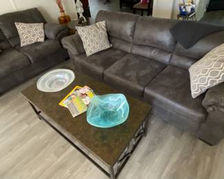 Matching sofa and reclining loveseat. Coffee table and two end table set.