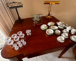 This is a half drop leaf table! On it are some delicate glass pieces and a 1930 Childs Tea Set! 