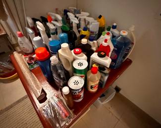 2 card tables STUFFED with cleaning supplies! Many NEW! 