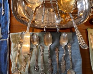 The teaspoons at the bottom center of the pic, on the blue cloth, are all sterling! 