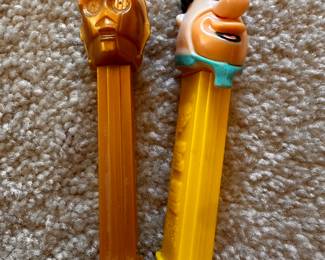 A large assortment of Vintage PEZ Dispensers! Here are 2 that are Character Themed! C3PO and Fred Flintstone! 