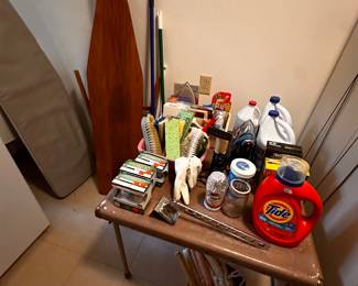 2 card tables STUFFED with cleaning supplies! Many NEW!  (Two ironing boards too!)