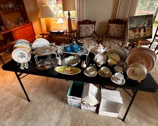 This 8 ft banquet table is filled with vintage porcelain! 