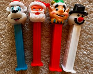 A large assortment of Vintage PEZ Dispensers! Here are 4 that are Christmas Themed!