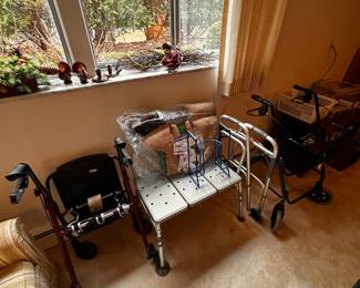 Three walkers - 1 regular, 1 nice and one Souped UP!  Also a very nice bathtub seat! 