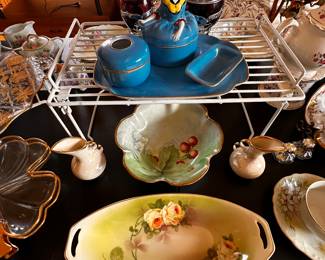 The bowls and plater are all hand painted and exquisite! The blue dresser set at the middle of the picture is a favorite! 