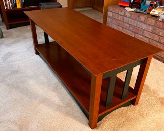A lovely coffee table, the table in the back of the photo is the matching TV stand! 