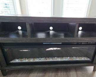 LG TV Stand with Fireplace            https://ctbids.com/estate-sale/31874/item/3541232/LG-TV-Stand-W-Fireplace